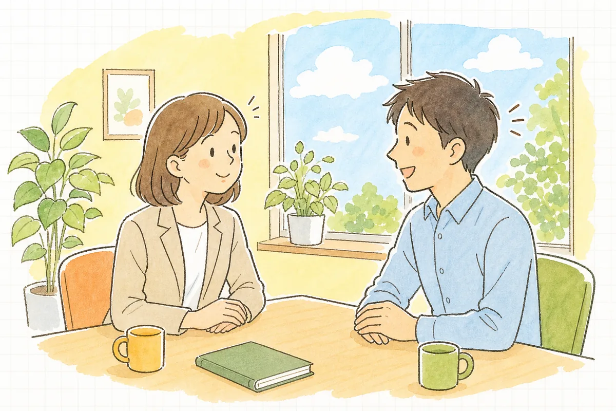明るい事務所で、出社した社員と労務担当者が向き合い、事情を話せてほっとした表情の社員に担当者が穏やかにうなずいている様子