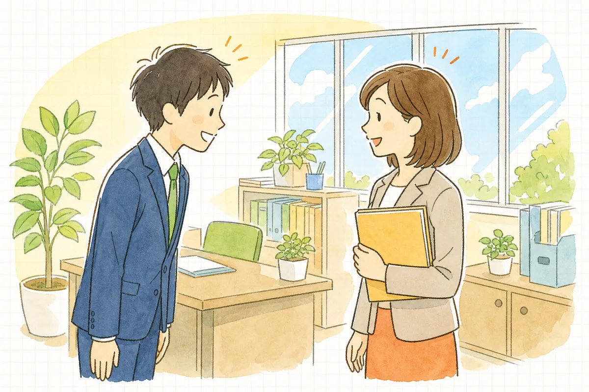 明るい事務所で、入社したばかりの社員が労務担当者に笑顔で迎えられ、二人で穏やかに話している様子